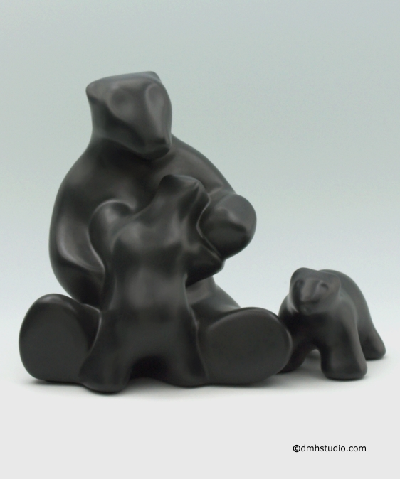 Large image of mother and child and baby polar bear sculptures in diamond black glaze, portrait facing forward toward the viewer.