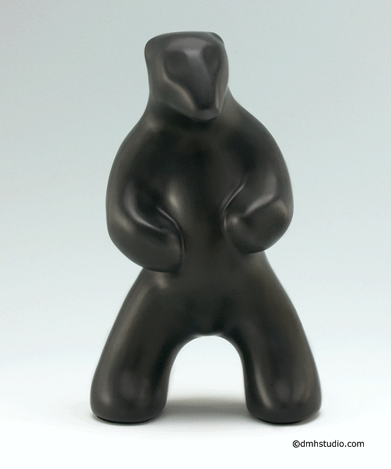 Large image of standing polar bear sculpture in diamond black, portrait facing the viewer.