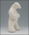 Image of standing polar bear sculpture in carrara white, portrait facing the viewers right.