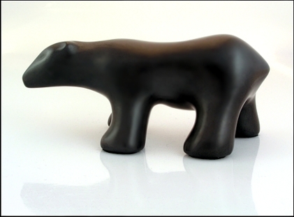 Image of walking polar bear sculpture in diamond black, profile facing to the viewers left.