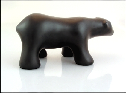 Image of walking polar bear sculpture in diamond black, profile facing to the viewers right.