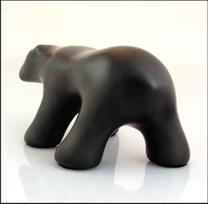 Image of waking polar bear sculpture in diamond black, portrait facing away and to the viewers left.