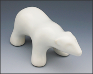 Image of walking polar bear sculpture in carrara white, 3/4 profile facing forward and to the viewers right.