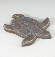Image of Baby Sea Turtle sculpture in starfield blue glaze, seen  from above, facing to the viewers right.