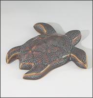 Image of Baby Sea Turtle sculpture in starfield blue glaze, seen  from above, facing to the viewers upper right.