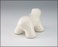 Image of baby polar bear sculpture in carrara white, facing away and to the right.