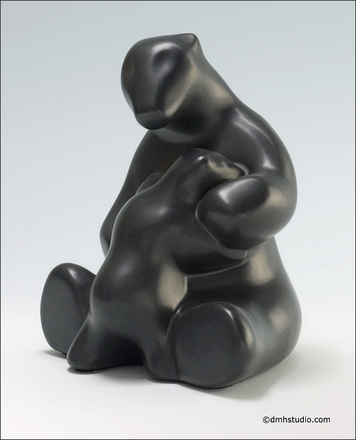 Large image of mother and child polar bear sculpture in diamond black, portrait facing the viewer.