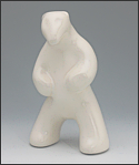 Image of standing polar bear sculpture in carrara white, portrait facing out toward the viewer.