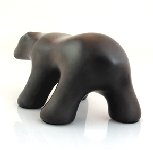 Image of waking polar bear sculpture in diamond black, portrait facing away and to the viewers left.