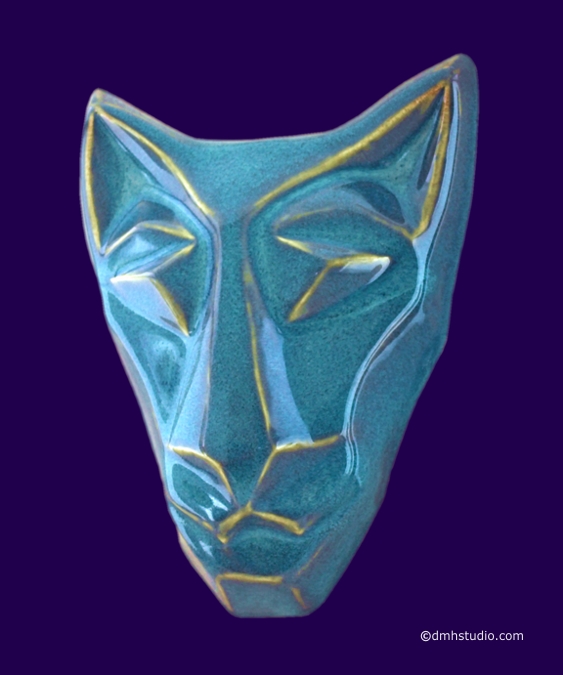 Large image of Brother cat mask in floating waterfall blue glaze. Portrait facing slightly to the viewers left.