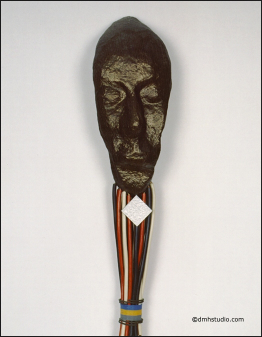 Large close-up image of Totem mask, portrait.