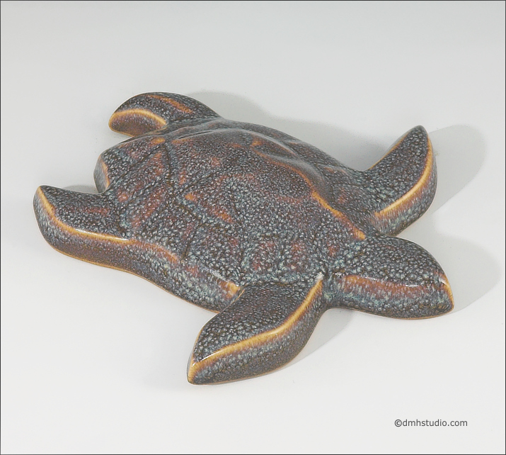 Large image of Baby Sea Turtle sculpture in starfield blue glaze, seen  from above, facing to the viewers right.